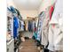 Walk-in closet with wood floor and plenty of clothes hanging on racks and shelf storage at 4703 David Cox Rd, Charlotte, NC 28269