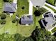 Aerial shot of a well-kept backyard with lush green grass and landscaping, including solar panels at 4966 Riverview Dr, Harrisburg, NC 28075