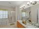 Bathroom featuring a double vanity, shower, and soaking tub at 4966 Riverview Dr, Harrisburg, NC 28075