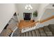 Inviting entryway with hardwood floors, a staircase, and a decorative chandelier overhead at 4966 Riverview Dr, Harrisburg, NC 28075