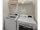 Functional laundry room with a new white washer and dryer at 4966 Riverview Dr, Harrisburg, NC 28075