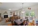 Cozy living room with hardwood floors, a fireplace, and sliding doors to an outdoor space at 4966 Riverview Dr, Harrisburg, NC 28075