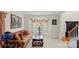 Traditional living room showcasing bay windows, a comfortable sofa, and elegant decor at 4966 Riverview Dr, Harrisburg, NC 28075