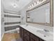 Bathroom with double vanity, large mirror, tiled floor, and shower with a decorative curtain at 5445 Creekwood Dr, Salisbury, NC 28147