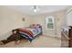Light and bright bedroom featuring a cozy bed, teddy bear, and natural light from the window at 5445 Creekwood Dr, Salisbury, NC 28147