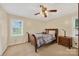 Bedroom featuring a bed, nightstand, ceiling fan, and neutral walls and carpet at 5445 Creekwood Dr, Salisbury, NC 28147