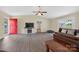 Open living room featuring durable floors, a large entertainment center, and a bright red entry door at 5445 Creekwood Dr, Salisbury, NC 28147