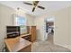 Office space with a wood desk, shelving, and carpet flooring at 5445 Creekwood Dr, Salisbury, NC 28147