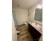 Clean bathroom featuring a vanity with a sink and a patterned shower curtain, combining practicality with style at 5707 S Rocky River Rd, Monroe, NC 28112