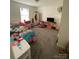 Bright bedroom with a window, plush carpeting, and playful decor, creating a comfortable space at 5707 S Rocky River Rd, Monroe, NC 28112