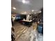 Open-concept kitchen with large island, stainless steel appliances, and hardwood floors at 5707 S Rocky River Rd, Monroe, NC 28112