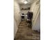 Functional laundry room with washer, dryer, and extra storage space, perfect for efficient home management at 5707 S Rocky River Rd, Monroe, NC 28112