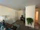 Inviting living room with neutral decor, hardwood floors, and ample natural light at 5707 S Rocky River Rd, Monroe, NC 28112