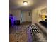 Main bedroom with accent lighting, plush carpeting, area rug, and closet access at 5707 S Rocky River Rd, Monroe, NC 28112