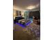 Comfortable main bedroom with accent lighting, plush carpeting and decorative wall art at 5707 S Rocky River Rd, Monroe, NC 28112