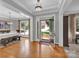 Elegant dining room with hardwood floors, chandelier, and ample natural light at 6016 Graburns Ford Dr, Charlotte, NC 28269