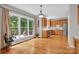 Spacious breakfast nook and kitchen feature wood cabinets, stainless appliances, and views of the backyard deck at 6016 Graburns Ford Dr, Charlotte, NC 28269