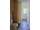 Cozy bathroom featuring a toilet, cabinet, and a combined shower-tub at 608 Sharon Dr, Statesville, NC 28625
