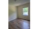 Bedroom with a large window, new floor, and neutral walls, providing natural light at 608 Sharon Dr, Statesville, NC 28625