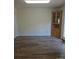 Spacious dining room featuring wood floors, a built-in hutch, and access to the outdoor deck at 608 Sharon Dr, Statesville, NC 28625