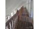 Hallway with wood floors and a wood railing at 608 Sharon Dr, Statesville, NC 28625
