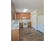 Well-lit kitchen boasts ample counter space and wood cabinetry for efficient storage at 608 Sharon Dr, Statesville, NC 28625