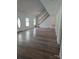 Bright living room with hardwood floors and large windows allowing ample natural light at 608 Sharon Dr, Statesville, NC 28625