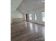 Living room with high ceilings, plentiful natural light, and a staircase leading upstairs at 608 Sharon Dr, Statesville, NC 28625