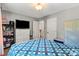 Bedroom with a white dresser, neutral carpet and walls, and a door to another room at 7151 Plough Dr, Mint Hill, NC 28227