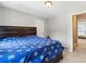 Bedroom with a blue comforter, a ceiling light, and a doorway leading to another room at 7151 Plough Dr, Mint Hill, NC 28227