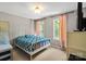 Cozy bedroom with two sunny windows, neutral carpet and walls, and a white metal bed frame at 7151 Plough Dr, Mint Hill, NC 28227
