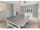 A bonus room with a ping pong table offers a versatile space for recreation, relaxation, or entertaining guests at 7151 Plough Dr, Mint Hill, NC 28227