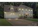 Charming traditional home with a two-car garage, manicured lawn, and covered front entrance at 7151 Plough Dr, Mint Hill, NC 28227