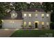 Charming traditional home with a two-car garage, manicured lawn, and covered front entrance at 7151 Plough Dr, Mint Hill, NC 28227