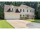 Charming traditional home with a two-car garage, manicured lawn, and covered front entrance at 7151 Plough Dr, Mint Hill, NC 28227