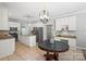 Open concept kitchen with breakfast nook, stainless appliances, granite countertops, and white cabinets at 7151 Plough Dr, Mint Hill, NC 28227