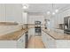 Bright kitchen with stainless appliances, granite countertops, and white cabinetry at 7151 Plough Dr, Mint Hill, NC 28227