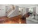 Spacious living room with hardwood floors and staircase, ideal for relaxation and entertaining at 7151 Plough Dr, Mint Hill, NC 28227