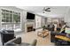 Bright living room with fireplace, natural light and open concept to kitchen at 7151 Plough Dr, Mint Hill, NC 28227