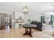 Open concept kitchen with breakfast nook, built-in desk, and living area at 7151 Plough Dr, Mint Hill, NC 28227