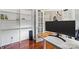 Modern office space with built-in shelving and natural light, ideal for productivity at 7151 Plough Dr, Mint Hill, NC 28227