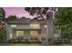 Exterior rear view of home with manicured landscaping and large windows at 7151 Plough Dr, Mint Hill, NC 28227