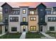 Modern townhome complex with a mix of brick and siding exteriors at 732 Falling Oak Aly # 22, Huntersville, NC 28078