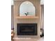 Modern fireplace with an elegant mantel and decorative mirror at 732 Falling Oak Aly # 22, Huntersville, NC 28078