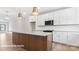 Spacious kitchen with white cabinets and a large center island at 732 Falling Oak Aly # 22, Huntersville, NC 28078