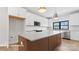 Bright kitchen featuring a large island, white cabinetry, and stainless appliances at 732 Falling Oak Aly # 22, Huntersville, NC 28078