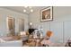 Stylish office with a glass top desk, modern lighting, and neutral wall paint at 732 Falling Oak Aly # 22, Huntersville, NC 28078