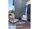 Cozy patio area with neutral furniture and sleek black trim and fixtures at 732 Falling Oak Aly # 22, Huntersville, NC 28078
