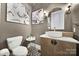 Elegant powder room with patterned tile floors, and modern vessel sink at 8016 Pemswood St, Charlotte, NC 28277