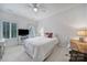 Well-lit bedroom featuring a comfy bed, white furnishings, and a nearby workspace at 8016 Pemswood St, Charlotte, NC 28277